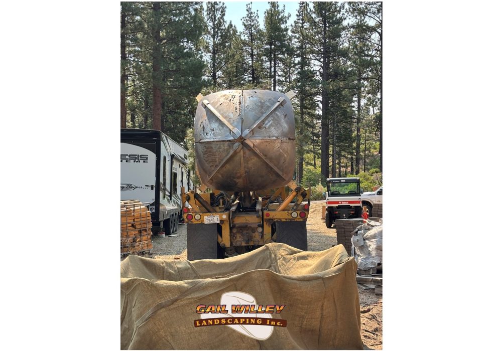 Large Tree Spade Truck holding a large evergreen tree , gail willey landscaping